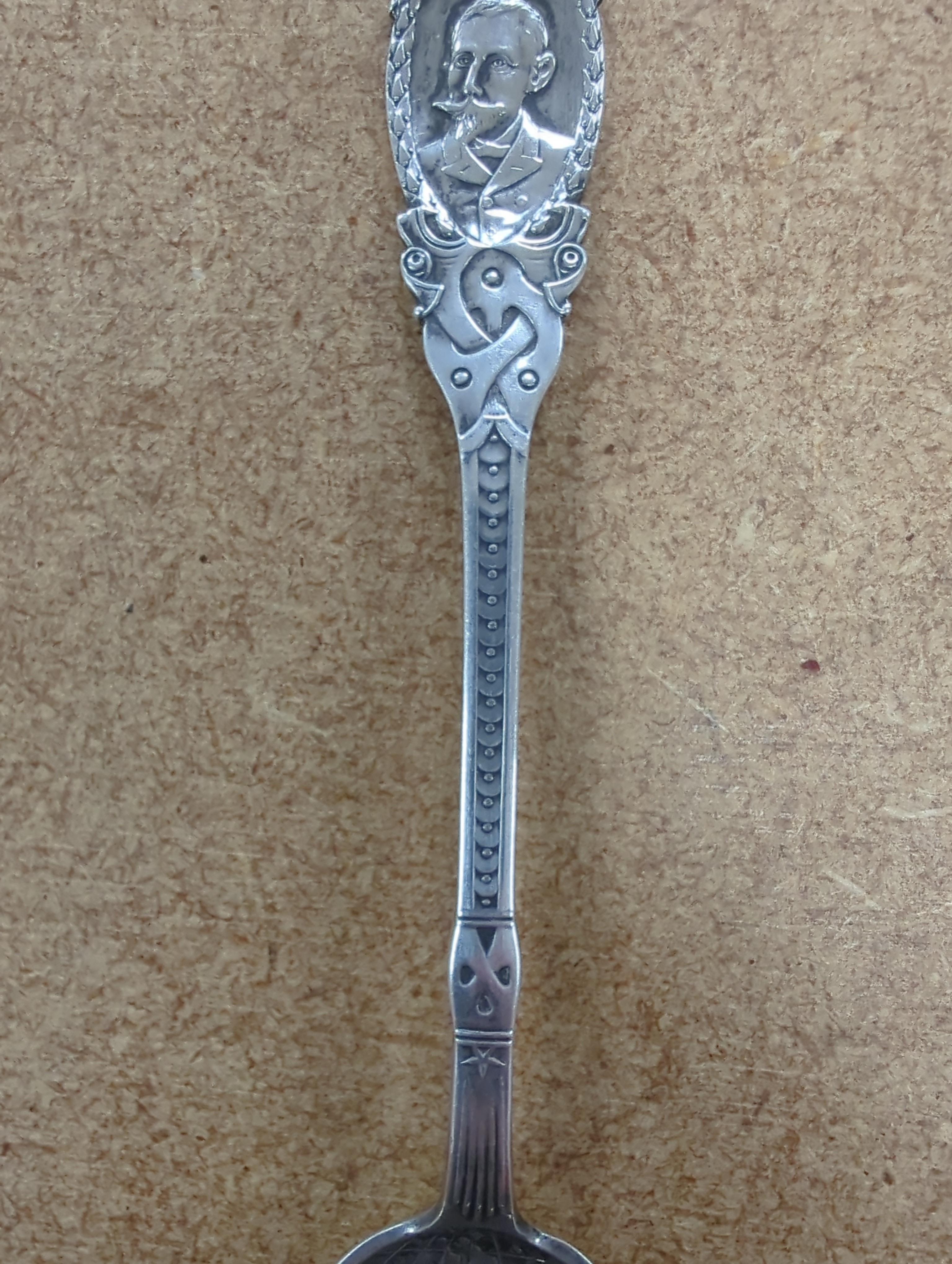 A Roald Amundsen commemorative .830 silver spoon, circa 1911, and five other commemorative spoons, of which four are silver including; Royal Military College, Small Arms School, Royal Army Service Corps, The Kensingtons
